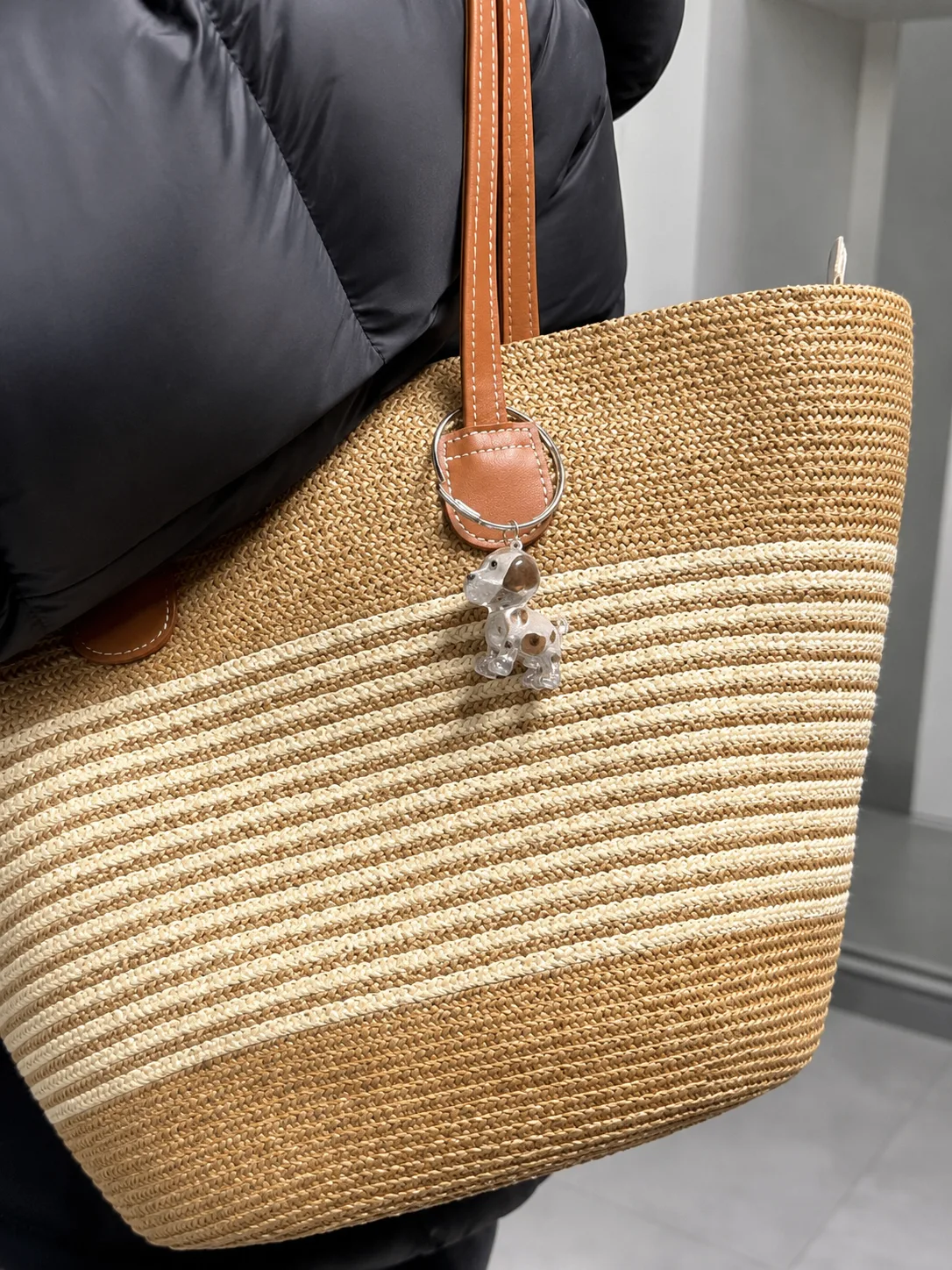 Dog-shaped EternalPaw keychain clipped onto a woven tote bag