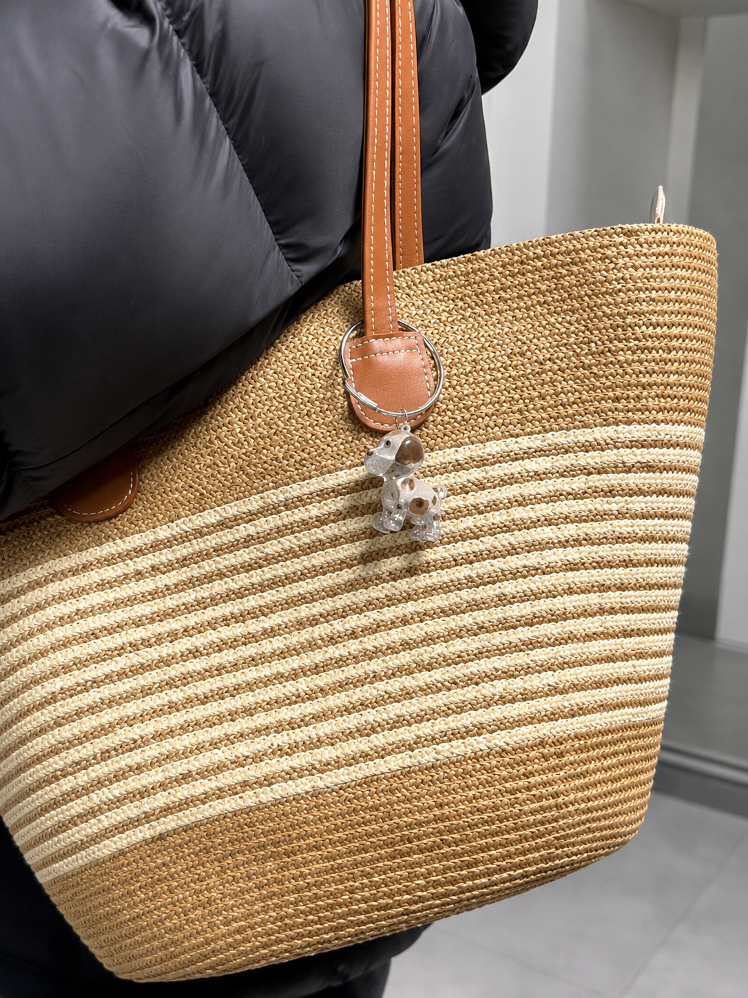 Dog-shaped EternalPaw keychain clipped onto a woven tote bag